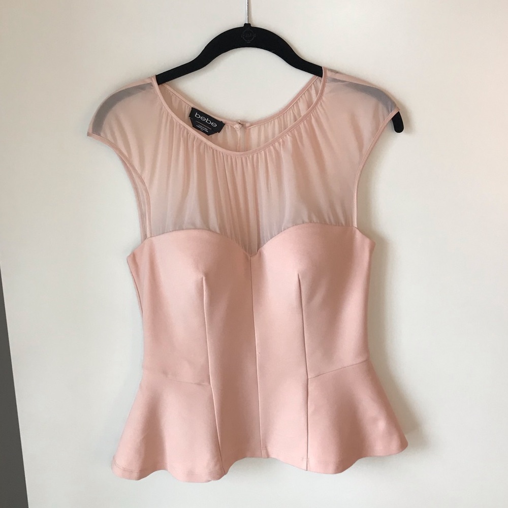 Pink and sheer Bebe peplum top